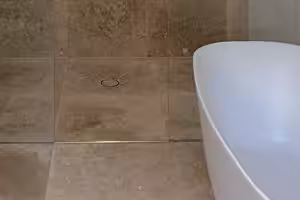 bathtub and stone tiles